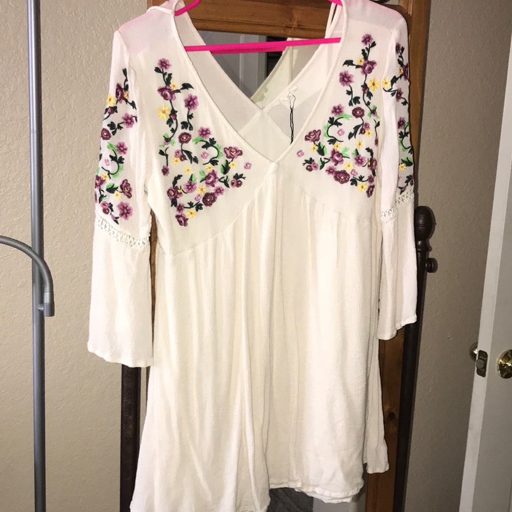 White dress with Beautiful flowers on chest part